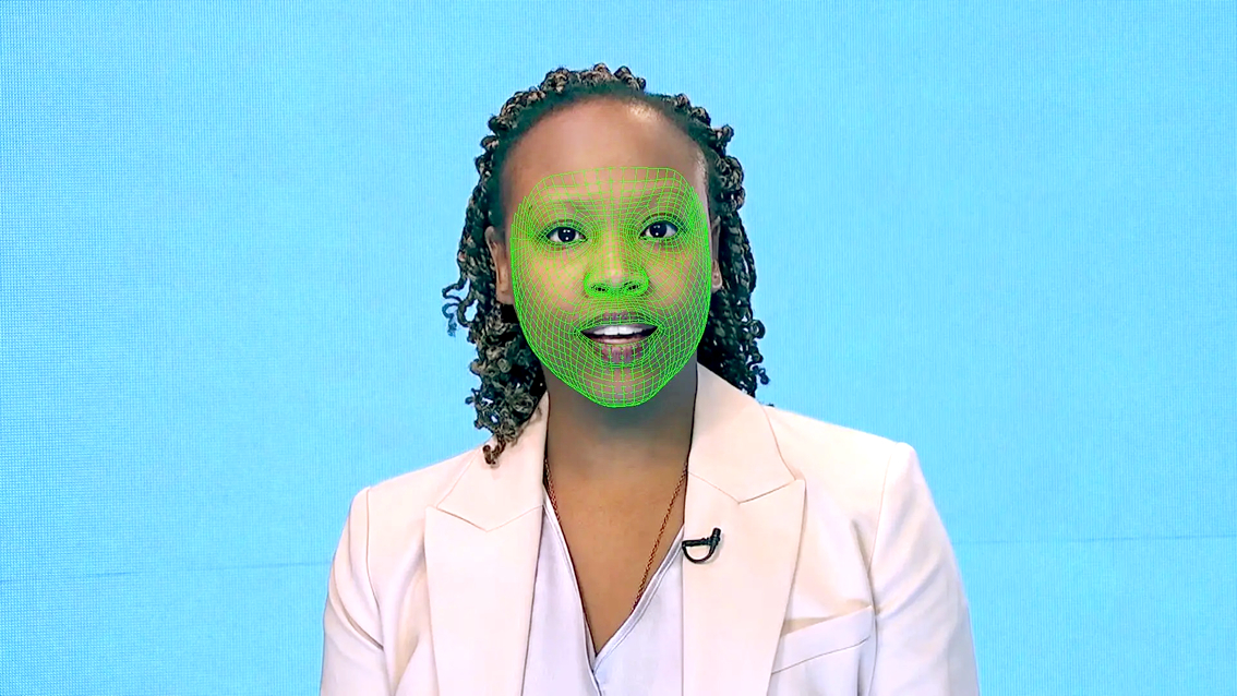 Một khuôn mặt được bao phủ bởi khung lưới, sử dụng cho việc tái tạo hình ảnh deepfake - ẢNH: REUTERS